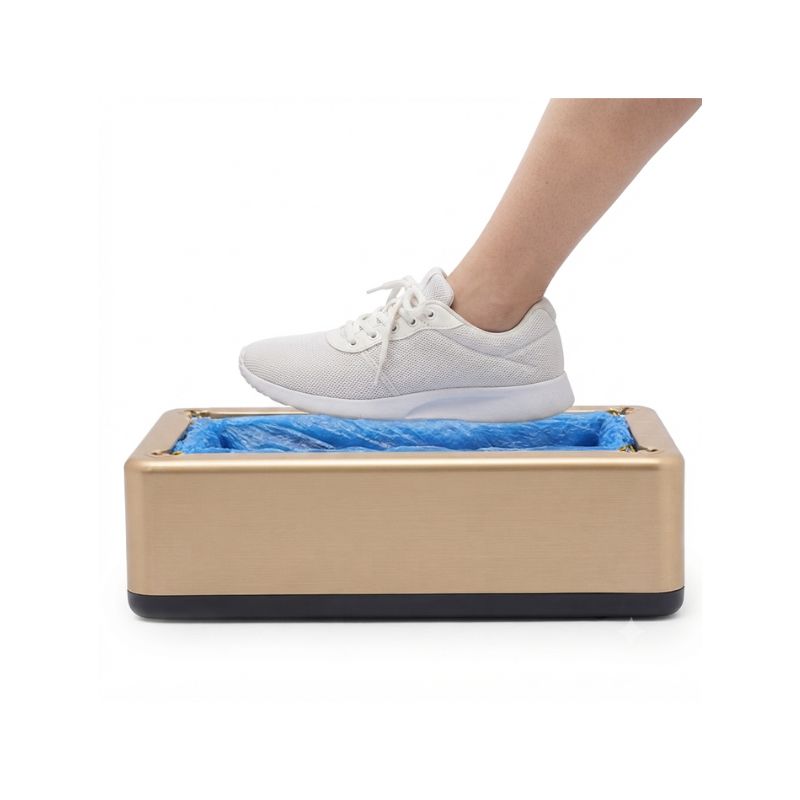 White sneaker placed smoothly inside the automatic shoe cover dispenser for a hands-free demonstration.