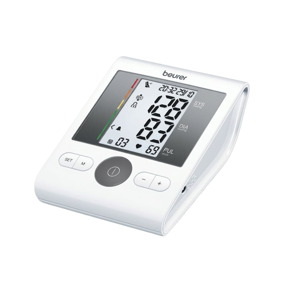 Beurer blood pressure monitor digital screen showing SYS, DIA, and PUL values with settings and memory functions.