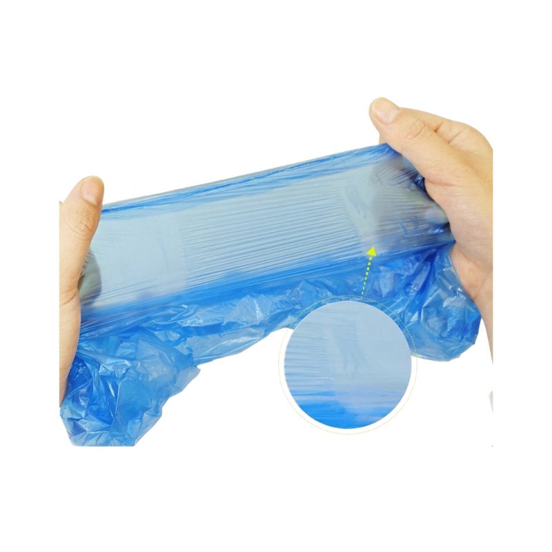 Hands stretching high-density chlorinated polyethylene shoe cover material to demonstrate elasticity and durability.