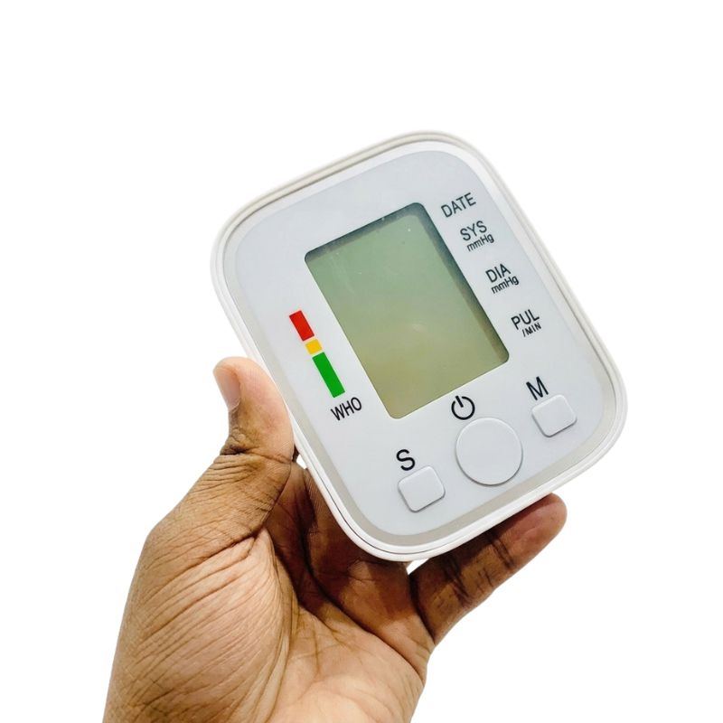 Close-up handheld view of the white digital display unit for a professional doctor bp machine.
