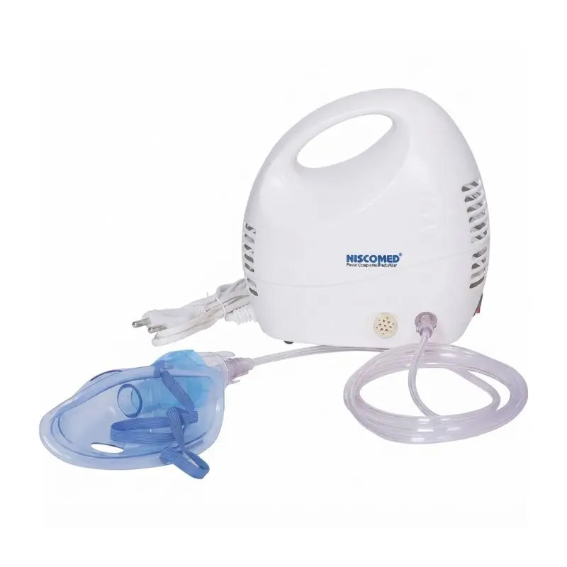 Fully assembled setup of the piston compressor nebulizer featuring the main compressor unit, air tubing, and inhalation mask.