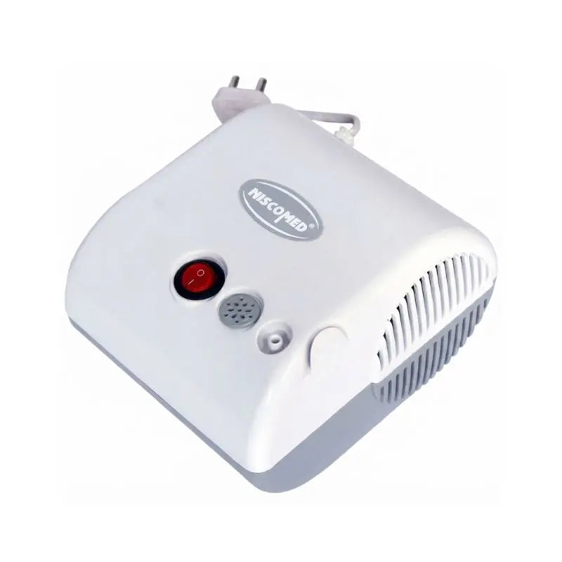 Close-up top-angle view of the main compressor housing of the portable nebulizer machine showing power switch and outlet.